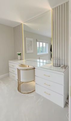 a large mirror sitting on top of a white counter