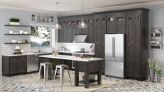 a large kitchen with gray cabinets and white counter tops, an island in the middle is surrounded by stools