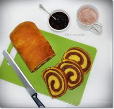 some food is laying out on a green cutting board next to a knife and bowl