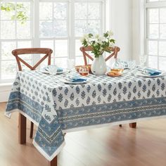 a table with a blue and white table cloth on it