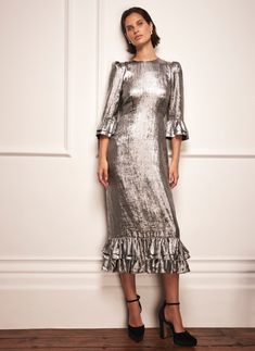 Silver metallic tone, midi silhouette, crew neckline, puff shoulders, 3/4 ruffle sleeves, layered ruffle hemline with a zip fastening through the back. Silver Midi Dress, Dress Mint, Glad Rags, Mint Velvet, Metallic Dress, Silver Dress, Ruffle Sleeves, Christmas Outfit, Effortless Style