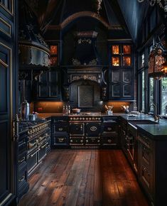 an old fashioned kitchen with wood floors and black cabinets