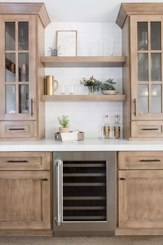 a kitchen with wooden cabinets and white counter tops