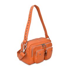 Ellie Silky in an orange design. The bag consists of a main compartment, a smaller compartment in the front with two pockets all with zip-closure. The bag comes with an adjustable detachable strap and a shoulder strap.Quality: 90% Leather / 10% CottonDimensions: H: 15 cm W: 24 cm D: 9 cm Modern Orange Shoulder Bag With Adjustable Strap, Modern Orange Shoulder Bag For Travel, Functional Orange Bag With Zipper Closure, Modern Orange Crossbody Shoulder Bag, Orange Bag With Zipper Pocket For Daily Use, Modern Orange Double Handle Shoulder Bag, Modern Orange Travel Bag, Orange Shoulder Bag With Detachable Strap For Daily Use, Modern Orange Satchel Shoulder Bag