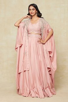 Peach cape with floral paisley embroidery. Comes with tonal embroidered blouse and embroidered waistband lehenga. - Aza Fashions Silk Choli With Cape Sleeves, Anarkali Cape Set For Eid, Anarkali Set With Cape For Eid, Fitted Embroidered Cape Sets, Embroidered Fitted Cape Sets, Fitted Gown With Chikankari Embroidery, Embroidered Fitted Sets With Cape Sleeves, Bohemian Silk Sets With Cape Sleeves, Fitted Floral Embroidery Sets With Cape Sleeves