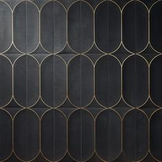 an abstract black and gold wallpaper with circles in the center, on top of it