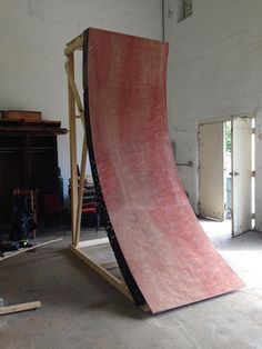 a skateboard ramp is being constructed in a garage