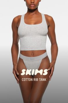 Everyone agrees - this tank is 10/10. This classic style is made with our iconic, breathable ribbed cotton that stretches to your curves for an all-day comfortable, flattering fit. Features a chic scoop neck and a slightly cropped length. Fits true to size. For a longer length, check out our Cotton Rib Long Tank. | SKIMS Tank Top | Grey | 2XL | Cotton Rib Length Check, Long Tank, Cotton Tank Top, Long Length, Heather Grey, Classic Style, Scoop Neck, Lounge Wear, Tank Top