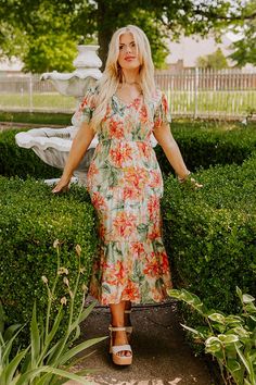 - Sip your sangria under the sun in this fabulous dress! - Lightweight material with green, orange, pink and purple hued floral print - A built-in skirt lining - A v-cut neckline - A smocked bodice - Short flutter sleeves - A flowy yet flattering silhouette that ends in a midi length hemline Measurements 1XL : Bust 36", Hip 42", Length 48.5", Sleeve Length 6.5", Waist 34". 2XL : Bust 38", Hip 44", Length 49", Sleeve Length 6.5", Waist 36". 3XL : Bust 40", Hip 46", Length 49.5", Sleeve Length 7", Skirt Lining, Fabulous Dresses, Purple Hues, V Cut, V Cuts, Pink And Purple, Floral Midi Dress, Flutter Sleeves, Sangria