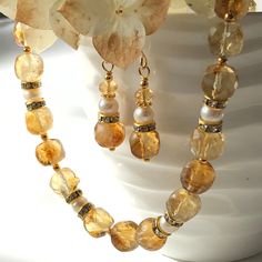 "7238 7239 Citrine Pearl Necklace Earrings natural yellow white gemstones boho statement choker dangle drops birthday anniversary Christmas holiday gift for her women mom sister wife girlfriend daughter niece aunt grandma cousin colleague best friend. Enjoy the beauty & power of natural gemstones.  This listing is for the NECKLACE or SET  Earrings listed separately at https://www.etsy.com/ca/listing/1592320917/citrine-pearl-earrings-natural-yellow?click_key=575dcc50f0db40e434962e291ea773a2caf391 White Dangle Jewelry With Gemstone Accents, Amber Jewelry With Faceted Beads For Gift, Yellow Dangle Necklaces As Gifts, Handmade Citrine Jewelry For Weddings, Yellow Teardrop Bohemian Jewelry, Yellow Gemstone Jewelry With Round Beads, Yellow Gemstone Round Beads Jewelry, Faceted Yellow Jewelry For Wedding, Gold Jewelry With Gemstone Beads For Anniversary