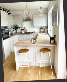 an image of a kitchen setting with stools