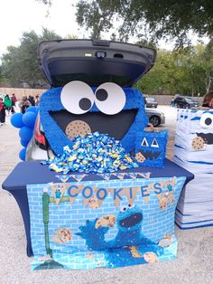 the cookie monster is in the trunk of his car with cookies all over it's body