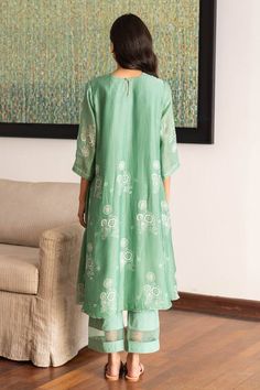 Mint green kurta featuring printed floral blooms, highlighted with thread embroidery. Comes with matching pant with a sheer hemline. - Aza Fashions Green Floral Embroidered Straight Kurta Set, Green Resham Embroidered Pant Set For Wedding, Green Resham Embroidery Pant Set For Wedding, Green Pant Set With Resham Embroidery For Wedding, Festive Green Pant Set With Resham Embroidery, Fitted Green Pant Set With Resham Embroidery, Green Festive Pant Set For Spring, Designer Green Embroidered Pant Set, Designer Embroidered Green Pant Set