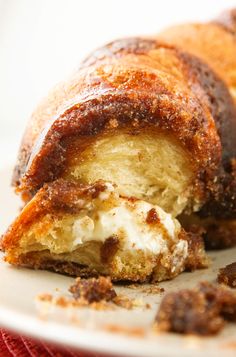 a close up of a pastry on a table with other pastries around the edges