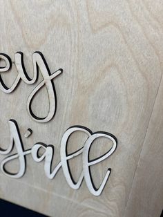 a wooden sign with the words buy and save carved into it's wood frame