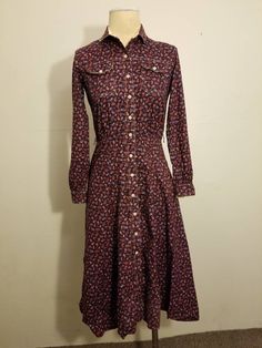 "++SUPER 70'S LANZ PAISLEY DRESS ++ Super retro dress Paisley print Button down Elastic waist Front pockets No size tags - would best fit a size XS/S In wonderful vintage condition - the hem has come undone in the back and just needs fixed - easy fix ✂ - - - Measurements laid flat: Pit to pit: 17\" Waist: 10\" up to 13\" Hips: 20\" Top to bottom: 42\" Let's be friends! https://www.facebook.com/TheGirlSaidYesVintage 18" Fitted Long Sleeve Dress With Vintage Print, Fitted Paisley Print Fall Dresses, Fitted Paisley Print Dress For Fall, Red Vintage Dress For Fall, Fitted Vintage Dress With Buttons For Fall, Vintage Paisley Print Dresses For Fall, Vintage Red Button-up Dress, Fitted Long Sleeve Vintage Dress With Buttons, Fitted Vintage Dress With Long Sleeves And Buttons