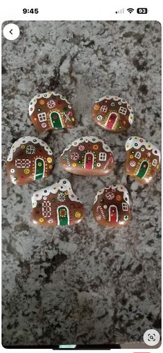 six gingerbread houses are sitting on the ground