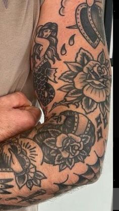 a man with a tattoo on his arm