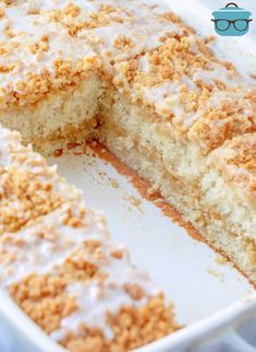 a close up of a cake in a pan with a slice missing from the cake