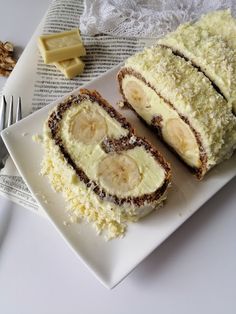 a white plate topped with sliced bananas and cream