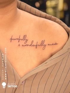 a woman with a tattoo on her chest that says, happily wonderfully mads