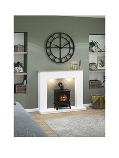 a living room with a clock on the wall and a fire place in the fireplace