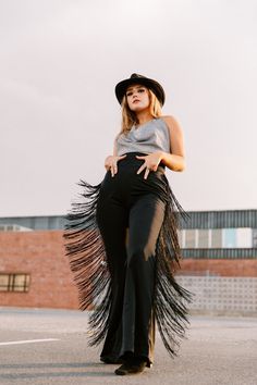 "Get your boots, get your hat and let's ride into the sunset! These bell bottom pants are a little bit country, a little bit rock and roll. They have extra long fringe all the way down the sides but they're matte black so you mostly catch it while in motion, such a dramatic effect! These trousers are also super easy to wear since they are very stretchy, you just pull them on, they have a high waist but you can fold the waistband down if you want. Made to order Inseam: 32\" to 34\" Material: matt Western Attire For Women, Cowgirl Inspired Outfit, Style Black Trousers, Headshot Outfit, Goth Cowgirl, Fringe Bottom Jeans, Traje Cowgirl, Dancing Outfit, Rodeo Outfit