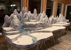 there are many tables that have ice sculptures on them