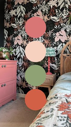 A cozy bedroom with colorful botanical wallpaper featuring oversized floral and leafy patterns in earthy tones, paired with a pink dresser, green bedside table, and natural woven textures, creating a vibrant and nature-inspired interior. Begonia Wallpaper, Statement Walls, Botanical Interior, Plants Pattern, Botanical Plants, Earthy Hues, Modern Botanical, Statement Wall