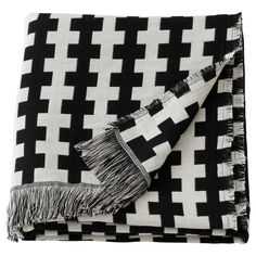 a black and white checkered blanket with fringes