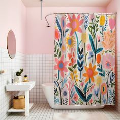 a bathroom with pink walls and floral shower curtain