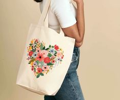 Featuring illustrated designs and a sturdy construction, our canvas tote bags are a pretty grab and go accessory for everything from school to daily errands. Handpainted Tote Bags, Colorful Tote Bags, Handpainted Bags, Flowers Tote, Painted Hats, Painted Tote, Heart Canvas, Painted Bags, Diy Tote Bag