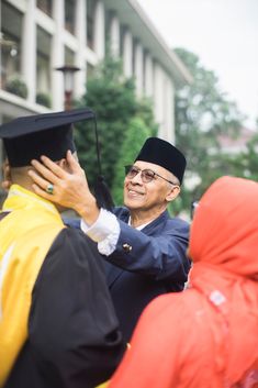 a man in a graduation cap and gown