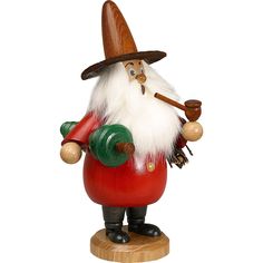 a red and white gnome figurine holding a pipe