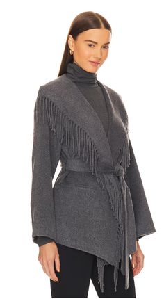 Self: 50% wool, 50% polyesterLining: 100% polyester Dry clean only Open front styling with melton waist tie Front slip pockets Melton fabric with foldover fringe trim Revolve Style No. JSKI-WO23 Manufacturer Style No. 523-7014-N Elegant Winter Outerwear With Tassels, Wool Fringe Outerwear For Fall, Fringed Wool Outerwear For Fall, Fall Wool Outerwear With Fringe, Chic Fringe Outerwear For Work, Winter Fringe Outerwear, Fall Outerwear With Tassels For Work, Fall Workwear Outerwear With Tassels, Fringe Jacket