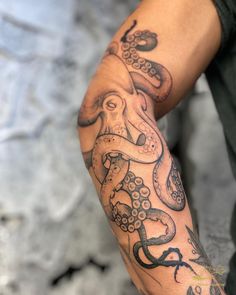 An arm with a blackwork octopus tattoo from mid-upper arm to wrist area. Clean lines Octopus Tattoo Hand Design, Octopus On Shoulder Tattoo, Octopus On Arm Tattoo, Knee Octopus Tattoo, Squid Arm Tattoo, Men’s Octopus Tattoo, Sea Life Leg Sleeve Tattoo, Crab Skeleton Tattoo, Nautical Shoulder Tattoo