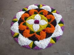 a colorful flower arrangement on the ground