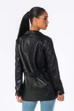 Black vegan leather jacket PETA-approved Lined throughout Removable belt Front button closures Model: 5’9” 34B Dress size 2-4 OW023-BLK Sleek Leather Belted Outerwear, Fitted Faux Leather Belted Outerwear, Trendy Fitted Outerwear With Belt Loops, Spring Fitted Belted Leather Jacket, Black Leather Outerwear With Belt, Black Biker Outerwear With Belt, Black Belted Biker Outerwear, Classic Belted Leather Jacket For Spring, Edgy Fitted Belted Leather Jacket