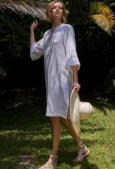 Eco friendly caftans and tunics inspired by the ocean, made on main street. Ethically sourced and locally made in Los Angeles. You asked, we delivered: A short version of our popular double gauze tunic dress. Simple, pared down, and easy, this is the ultimate 'throw-on-and-go' dress. Made in our soft, double gauze fabric, it drapes as beautifully as it launders. (It's hard to believe, but it gets softer and softer with each wash, and, it won't shrink). With pockets and a classic v neckline, this Bohemian Tunic For Daywear With Relaxed Fit, Bohemian Tunic With Relaxed Fit For Daywear, Casual Beach Tunic With Split Neck, Casual Split Neck Tunic For Beach, Casual Split Neck Beach Tunic, Summer Cotton Gauze Loungewear Dress, Summer Cotton Gauze Lounge Dress, Summer Cotton Gauze Dress For Loungewear, Spring Beach Tunic With Split Neck