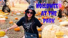 a woman is posing in front of pumpkins with skeletons on them and the words halloween at the park