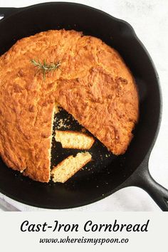 cast iron cornbread in a skillet with a slice cut out