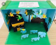 an open box with elephants and birds on it