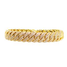 Description This astonishing Italian Designer bracelet is adorned with a delicate array of brilliant cut Diamonds totaling: 2.26ct. This bangle is encased in 18K yellow gold. Details Bracelet Style Bangle Total Weight 2.26 ct. (Diamonds) Stone Type Diamond Stone Shape Round Cut Size 7 inches Setting Material 18K Yellow Gold Diamond Cut Cubic Zirconia Bangle Bracelet, Cubic Zirconia Bangle Bracelet With Diamond Cut, Yellow Gold Cubic Zirconia Tennis Bracelet With Pave Setting, Gold Diamond Bangle Bracelet With Pavé Setting, Dazzling Hand-set Yellow Gold Diamond Bracelet, Yellow Gold Diamond-cut Bangle Bracelet, Yellow Gold Tennis Bangle Bracelet, Dazzling Diamond Yellow Gold Bracelet, Gold Diamond Bangle Bracelet With Vvs Clarity