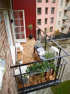 a balcony with potted plants on it