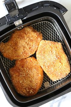 four fried meat patties in an air fryer