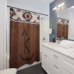 a bathroom with a shower curtain, sink and toilet