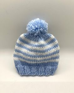 Adorable baby blue striped baby hat with pom pom.  Soft and washable! Hat With Pom Pom, Blue Baby, Pom Pom Hat, Baby Hat, Skull Cap Beanie, Adorable Baby, Crete, Skull Cap, Baby Hats