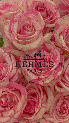 pink and white roses are arranged in a bouquet with the words hermes paris on it