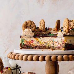 a piece of cake sitting on top of a white plate next to other desserts