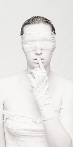 a woman with bandages on her face and hands